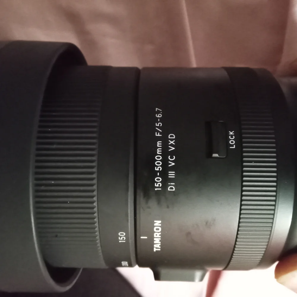 Black Telephoto Zoom Lens with Textured Focusing Ring and Robust Construction